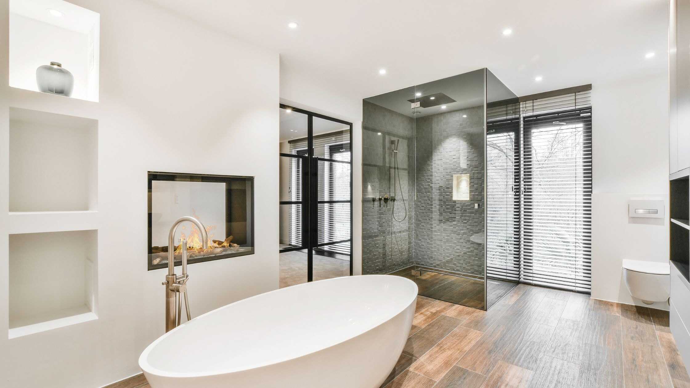 Modern Bathroom Luxurious modern bathroom with a freestanding bathtub and a spacious glass-enclosed shower. Elegant.