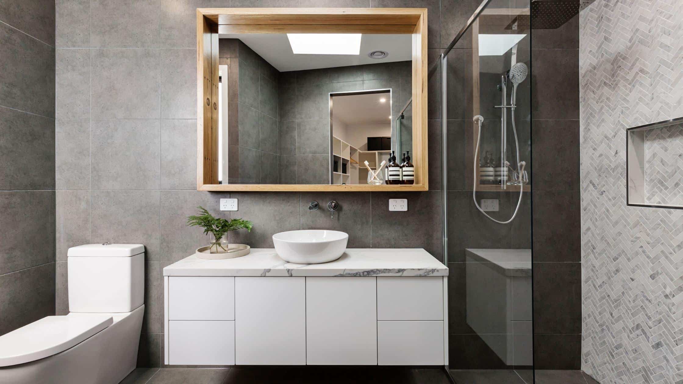 Stylish modern bathroom with sleek design, walk-in shower, and contemporary fixtures.