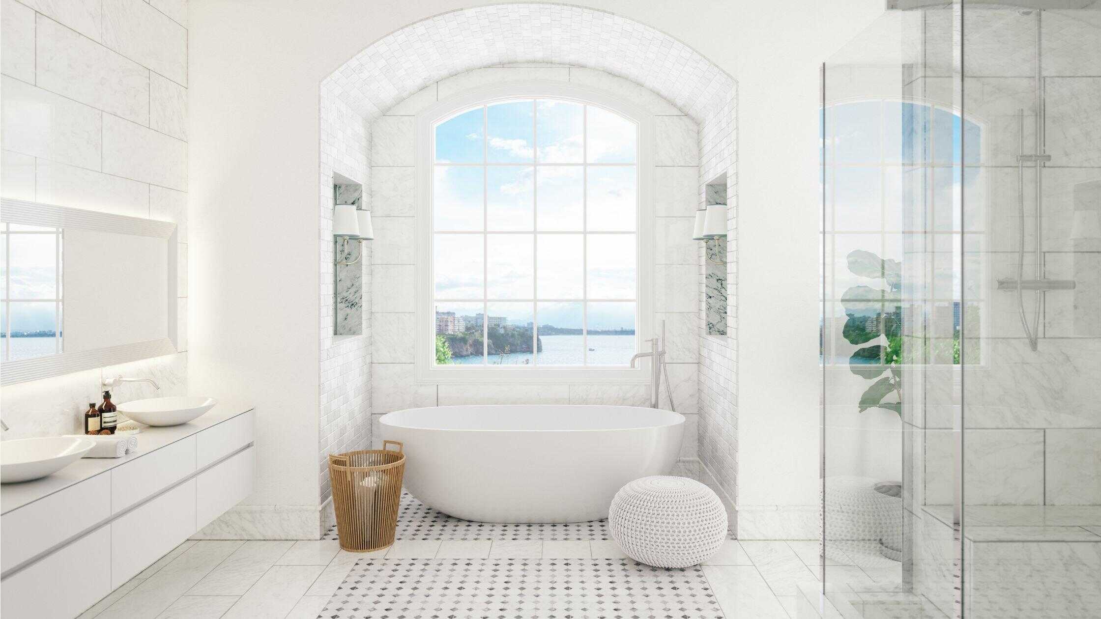 Elegant bathroom with a freestanding bathtub and large window overlooking a scenic view.